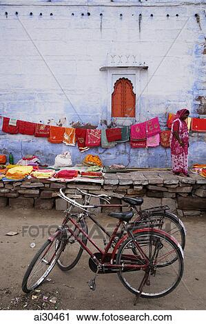 Woman selling saris outside Sadar Market. Jodhpur, India View Large Photo Image Stock Image - Woman selling saris outside Sadar Market. Jodhpur, India. Fotosearch