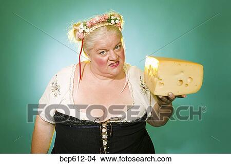 Angry Germanic woman with cheese wedge View Large Photo Image Picture - Angry Germanic woman with cheese wedge. Fotosearch