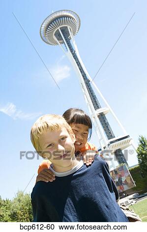 Boy and girl with space needle View Large Photo Image Stock Image - Boy and girl with space needle. Fotosearch
