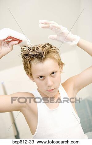 Boy dying hair with dramatic expression View Large Photo Image Stock Image - Boy dying hair with dramatic expression. Fotosearch