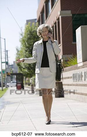 Businesswoman talking on mobile phone View Large Photo Image Stock Photo - Businesswoman talking on mobile phone. Fotosearch