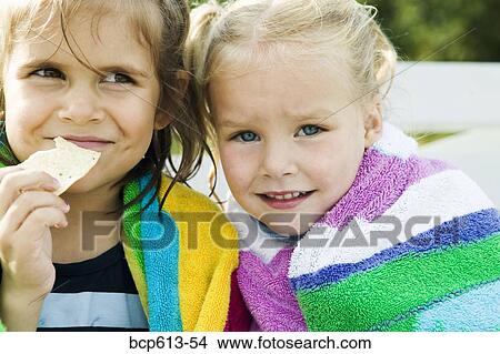 Closeup of two little girls in towels View Large Photo Image Picture - Closeup of two little girls in towels. Fotosearch