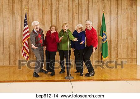 Enthusiastic elderly people singing on stage View Large Photo Image Picture - Enthusiastic elderly people singing on stage. Fotosearch
