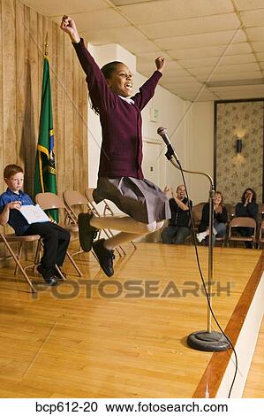 Excited girl winning competition View Large Photo Image Stock Image - Excited girl winning competition. Fotosearch