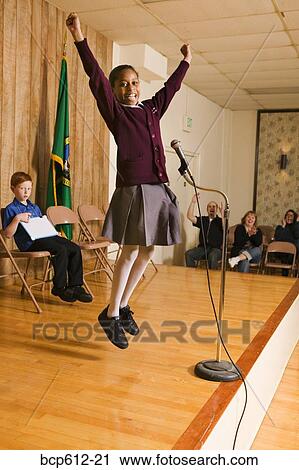 Excited girl winning competition View Large Photo Image Stock Image - Excited girl winning competition. Fotosearch