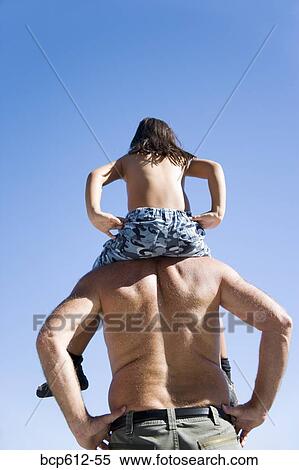 Father carrying daughter on shoulders View Large Photo Image Stock Photography - Father carrying daughter on shoulders. Fotosearch