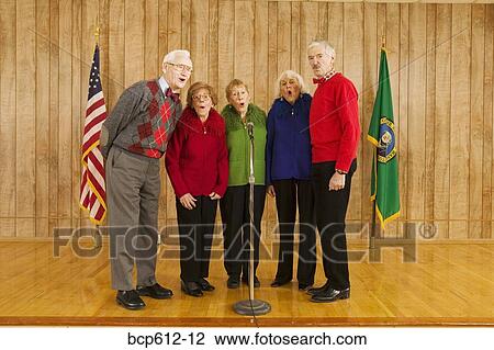 Group of elderly people singing on stage View Large Photo Image Stock Image - Group of elderly people singing on stage. Fotosearch