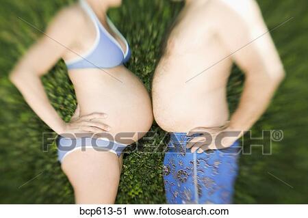 Man and pregnant woman touching bellies View Large Photo Image Stock Image - Man and pregnant woman touching bellies. Fotosearch