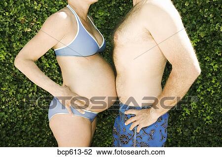 Man and pregnant woman touching bellies View Large Photo Image Stock Image - Man and pregnant woman touching bellies. Fotosearch