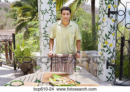 Man on sunny veranda with meal View Large Photo Image Picture - Man on sunny veranda with meal. Fotosearch