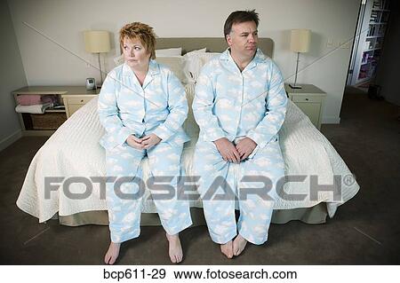 Overweight couple in matching pajamas View Large Photo Image Stock Photo - Overweight couple in matching pajamas. Fotosearch