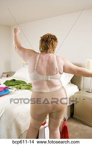 Overweight woman dancing in underclothes View Large Photo Image Picture - Overweight woman dancing in underclothes. Fotosearch
