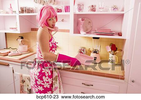 Pink haired woman on phone in kitchen View Large Photo Image Stock Image - Pink haired woman on phone in kitchen. Fotosearch