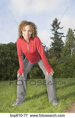 Portrait of athletic woman on lawn View Large Photo Image Stock Photo - Portrait of athletic woman on lawn. Fotosearch