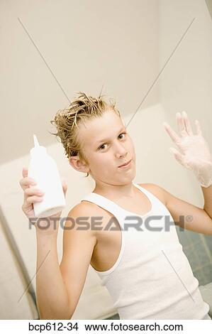 Portrait of boy styling hair View Large Photo Image Picture - Portrait of boy styling hair. Fotosearch