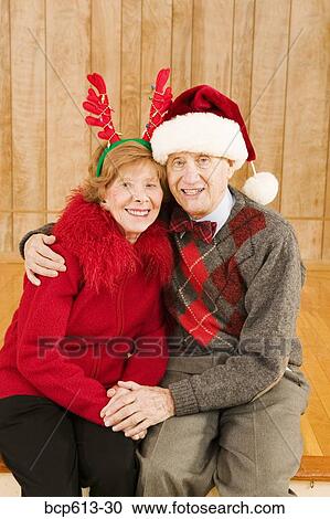 Portrait of elderly couple at Christmastime View Large Photo Image Stock Image - Portrait of elderly couple at Christmastime. Fotosearch