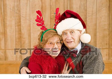 Portrait of elderly couple at Christmastime View Large Photo Image Stock Image - Portrait of elderly couple at Christmastime. Fotosearch