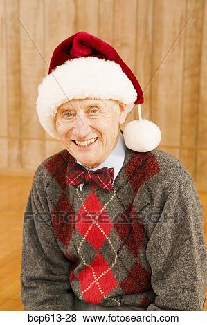 Portrait of elderly man wearing santa hat View Large Photo Image Stock Photo - Portrait of elderly man wearing santa hat. Fotosearch