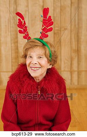 Portrait of elderly woman at Christmastime View Large Photo Image Stock Photo - Portrait of elderly woman at Christmastime. Fotosearch