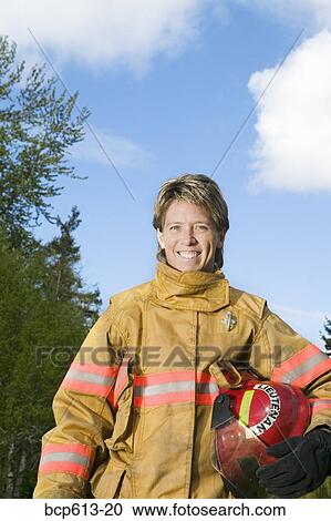 Portrait of female firefighter outside View Large Photo Image Stock Image - Portrait of female firefighter outside. Fotosearch