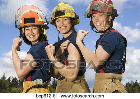 Portrait of female firefighters flexing biceps View Large Photo Image Stock Image - Portrait of female firefighters flexing biceps. Fotosearch