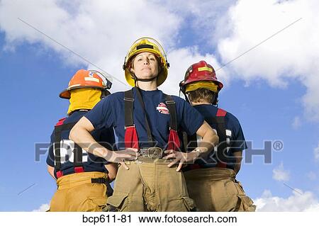 Stock Image - Portrait of female firefighters outside. Fotosearch