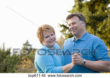 Portrait of middle aged couple dancing outside View Large Photo Image Stock Photography - Portrait of middle aged couple dancing outside. Fotosearch
