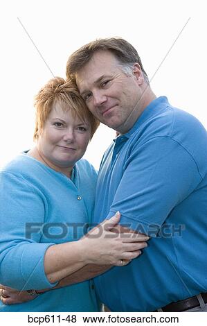 Portrait of middle aged couple hugging View Large Photo Image Stock Photo - Portrait of middle aged couple hugging. Fotosearch