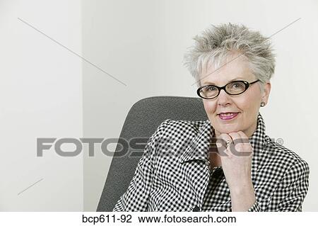 Portrait of stylish middle aged businesswoman View Large Photo Image Stock Image - Portrait of stylish middle aged businesswoman. Fotosearch