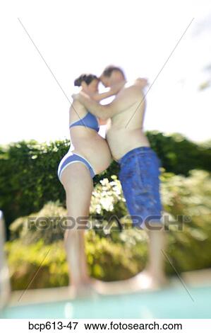 Pregnant woman and man at pool View Large Photo Image Stock Photo - Pregnant woman and man at pool. Fotosearch