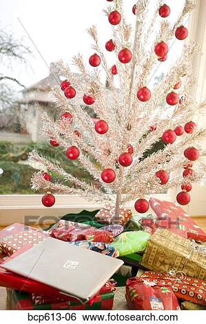 Stock Photograph - Presents under tree on Christmas morning. Fotosearch