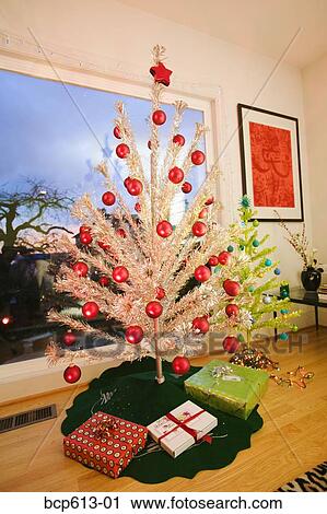 Two fake Christmas trees in living room View Large Photo Image Stock Image - Two fake Christmas trees in living room. Fotosearch