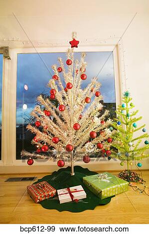 Two fake Christmas trees in living room View Large Photo Image Stock Photo - Two fake Christmas trees in living room. Fotosearch