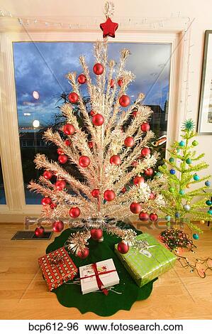 Two fake Christmas trees in living room View Large Photo Image Stock Photograph - Two fake Christmas trees in living room. Fotosearch