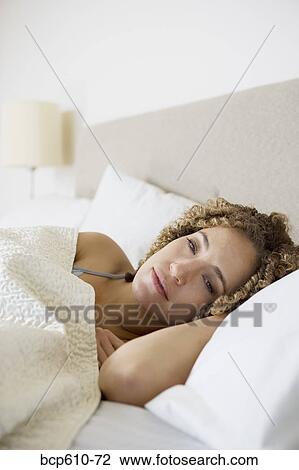 Woman awaking from sleep in bed View Large Photo Image Stock Image - Woman awaking from sleep in bed. Fotosearch