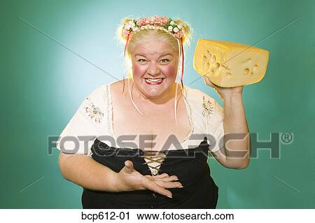 Woman in Germanic costume with cheese wedge View Large Photo Image Stock Image - Woman in Germanic costume with cheese wedge. Fotosearch