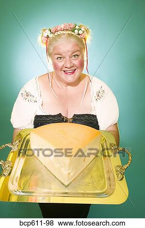 Woman in Germanic costume with cheese wedge View Large Photo Image Stock Photo - Woman in Germanic costume with cheese wedge. Fotosearch