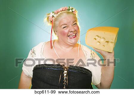 Woman in Germanic costume with cheese wedge View Large Photo Image Stock Photo - Woman in Germanic costume with cheese wedge. Fotosearch