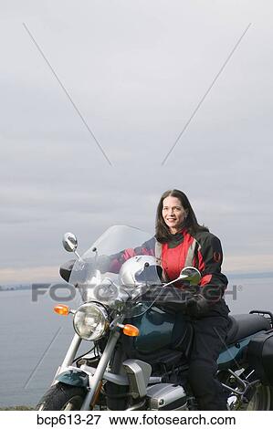 Woman posing on motorcycle View Large Photo Image Stock Photo - Woman posing on motorcycle. Fotosearch