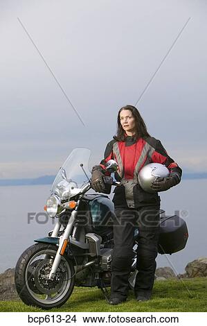 Woman posing with motorcycle View Large Photo Image Picture - Woman posing with motorcycle. Fotosearch