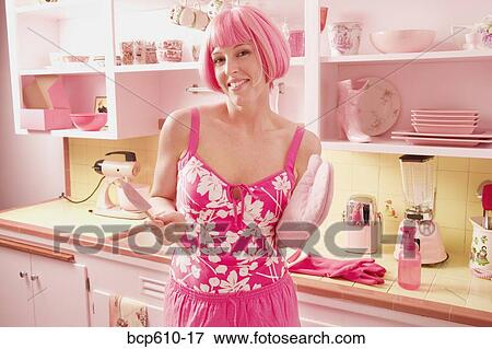 Woman with pink hair in pink kitchen View Large Photo Image Stock Photo - Woman with pink hair in pink kitchen. Fotosearch