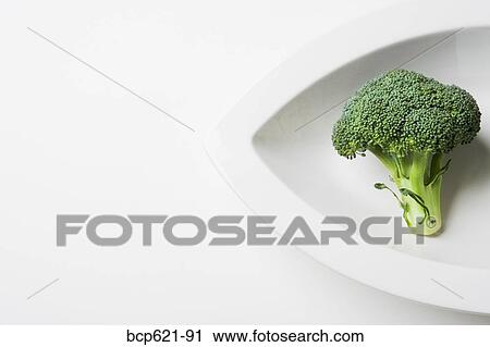 Broccoli crown in a dish View Large Photo Image Stock Image - Broccoli crown in a dish. Fotosearch