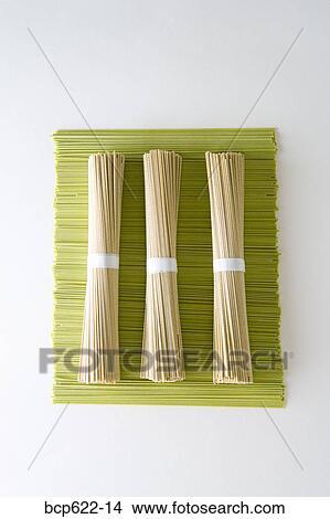 Bundles of soba noodles on green tea noodles View Large Photo Image Picture - Bundles of soba noodles on green tea noodles. Fotosearch
