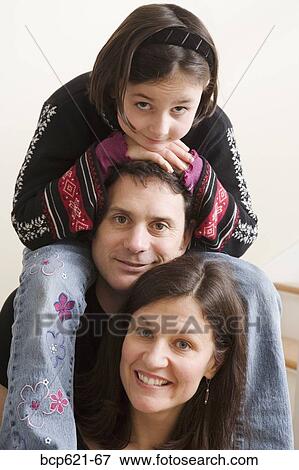 Closeup of couple with their daughter View Large Photo Image Stock Photo - Closeup of couple with their daughter. Fotosearch