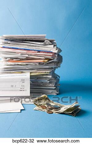 Stock Image - Closeup of stack of bills with money. Fotosearch