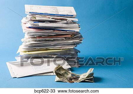 Stock Image - Closeup of stack of bills with money. Fotosearch