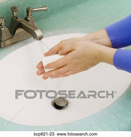 Closeup of washing hands in bathroom sink View Large Photo Image Stock Image - Closeup of washing hands in bathroom sink. Fotosearch