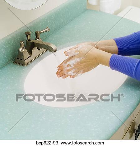 Closeup of washing hands in bathroom sink View Large Photo Image Stock Image - Closeup of washing hands in bathroom sink. Fotosearch