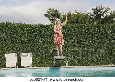 Elderly woman dancing on diving board View Large Photo Image Stock Image - Elderly woman dancing on diving board. Fotosearch