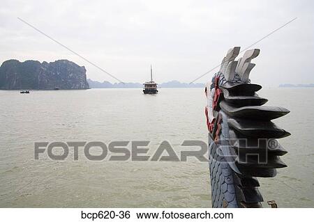Figurehead and view from tour boat in Vietnam View Large Photo Image Stock Photograph - Figurehead and view from tour boat in Vietnam. Fotosearch